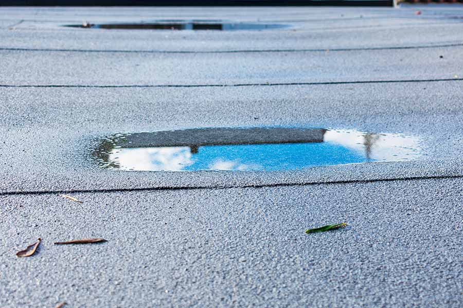 Ponding Water On A Flat Roof: How Serious Is It Really?